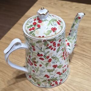 Vintage "The Design" Holly And Berry Teapot w/ Lid and Teacup w/ Saucer